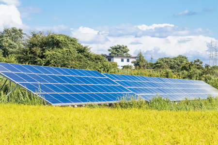 Solar  power panels for innovation green energy for life with mountains and blue sky background.の写真素材