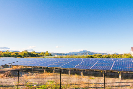 Solar power panels ,Photovoltaic modules for innovation green energy for life with blue sky background.の写真素材
