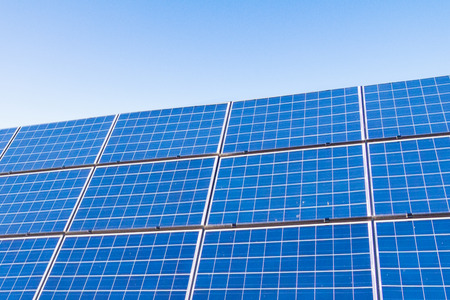 Solar power panels ,Photovoltaic modules for innovation green energy for life with blue sky background.の写真素材