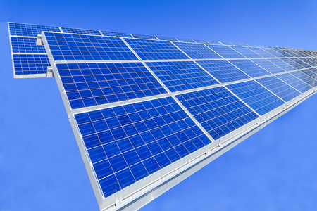 Solar power panels ,Photovoltaic modules for innovation green energy for life with blue sky background.の写真素材