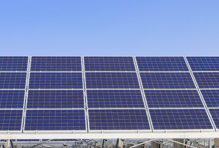 Solar power panels ,Photovoltaic modules for innovation green energy for life with blue sky background.の写真素材