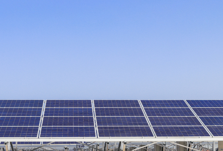 Solar power panels ,Photovoltaic modules for innovation green energy for life with blue sky background.の写真素材