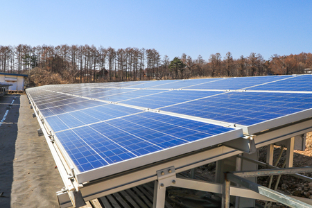 Solar power panels ,Photovoltaic modules for innovation green energy for life with blue sky background.の写真素材