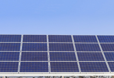 Solar power panels ,Photovoltaic modules for innovation green energy for life with blue sky background.の写真素材