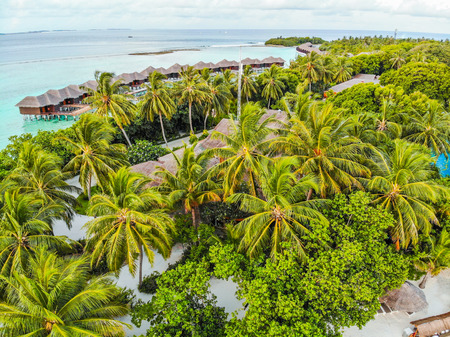 Amazing island in the Maldives ,water villa ,white sandy beach  and beautiful  turquoise waters with  blue sky  background for holiday vacation .の写真素材