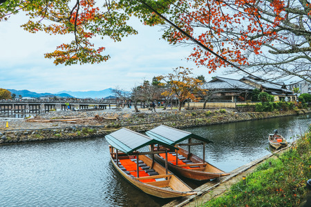 Beautiful the river and boat in Arashiyama Kyoto Japan in autumn season .の写真素材
