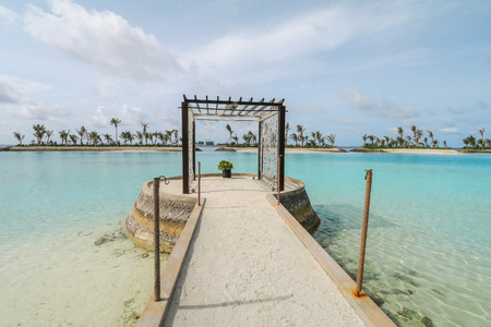 Amazing island in the Maldives ,Beautiful turquoise waters and white sandy beach with  blue sky  background for holiday vacation .の写真素材