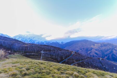 Beautiful landscape view of  Hakuba in the winter with snow on the mountain and blue sky background in Nagano Prefecture Japan.の写真素材