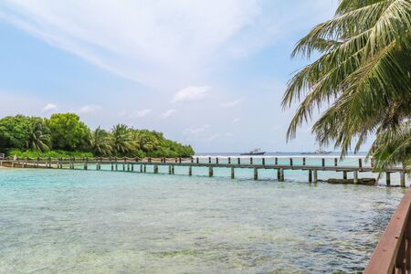Amazing island in the Maldives ,Beautiful turquoise waters and white sandy beach with  blue sky  background for holiday vacation .の写真素材