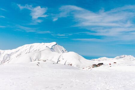 The japan alps  Tateyama Kurobe alpine  in sunshine day with  blue sky background is one of the most important and popular natural place in Toyama Prefecture, Japan.の写真素材