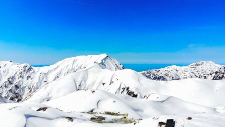 The japan alps  Tateyama Kurobe alpine  in sunshine day with  blue sky background is one of the most important and popular natural place in Toyama Prefecture, Japan.の写真素材