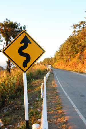 Winding signpost on the roadの写真素材