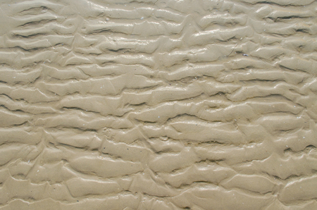 Abstract sand texture caused by water flowの写真素材