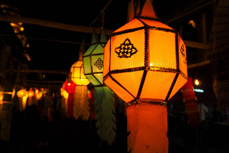 orange glowing Lanna lantern at night,craft for celebrate festival in northern of thailand.の写真素材