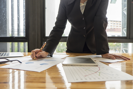 Business people analyzing investment charts in meeting room, Accounting concept, soft focus, vintage toneの写真素材