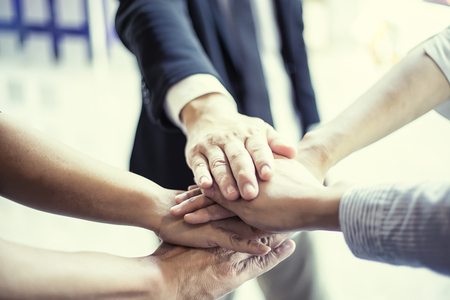 people showing unity with their hands together, teamwork and together concept, soft focus, vintage toneの写真素材
