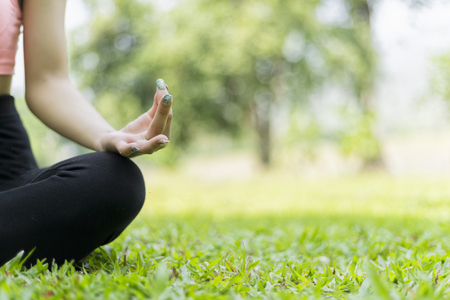 beautiful woman relax yoga in the parkの写真素材