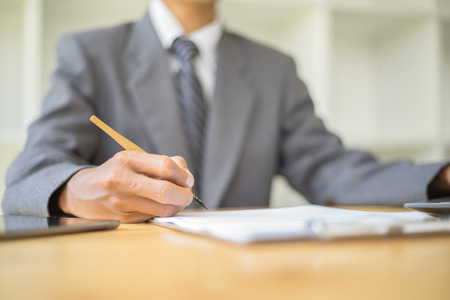 business people signing a document to agreement business, Business success conceptの写真素材