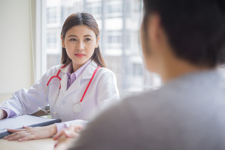 doctor talking with patient in hospital, medical conceptの写真素材