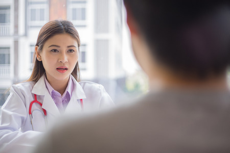 doctor talking with patient in hospital, medical conceptの写真素材