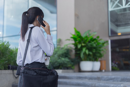 modern business woman working with smartphone outdoor, business conceptの写真素材