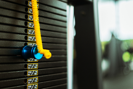 Fitness background with exercise-machine in gym, sport concept
