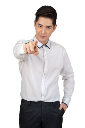 Happy young businessman in suit looking at camera on white background, isolated conceptの写真素材