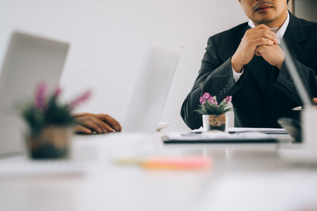 Business people analyzing investment graph meeting brainstorming and discussing plan in meeting room, investment conceptの写真素材