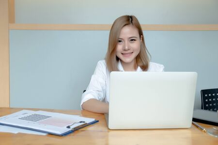 Businesswomen analyzing investment  graph and discussing plan in meeting room, investment concept
