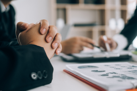 Business people analyzing investment graph meeting brainstorming and discussing plan in meeting room, investment conceptの写真素材