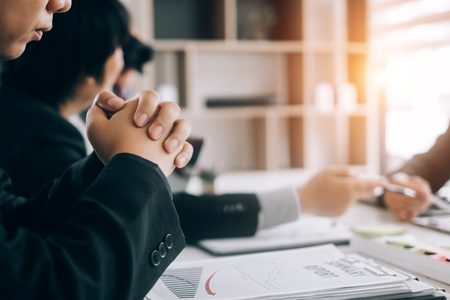 Business people analyzing investment graph meeting brainstorming and discussing plan in meeting room, investment conceptの写真素材