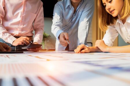 Businesspeople analyzing investment graph meeting brainstorming and discussing plan in meeting room, investment conceptの写真素材