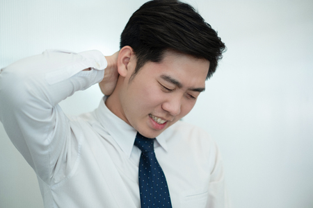 Businessman feel pain in their back while working in the office, medical conceptの写真素材