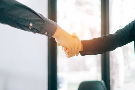 Business people partners shaking hands after complete agreement plan in meeting room, investment concept, success conceptの写真素材
