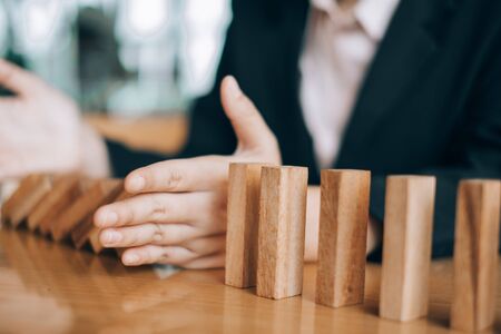 business woman smiling playing and building wooden at the office, investment conceptの写真素材