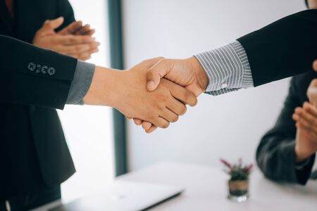 Business people partners shaking hands after complete agreement plan in meeting room, investment concept, success conceptの写真素材