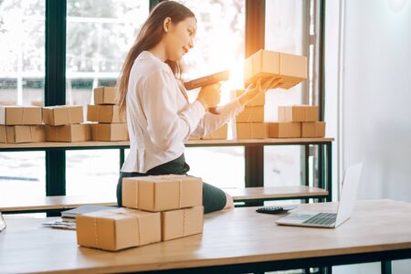 happy women checking order online business with laptop in home, online business concept, business online conceptの写真素材