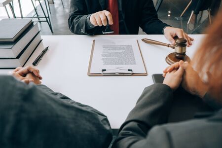 smart lawyer holding stamp for submit documents  with advice in the office before considering the...