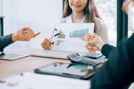 Business people analyzing investment graph meeting brainstorming and discussing plan in meeting room, investment conceptの写真素材
