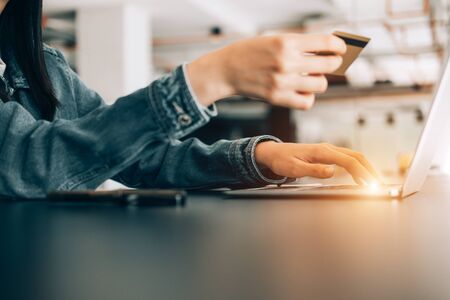beautiful woman holding credit card using laptop enjoy shopping website online, shopping concept