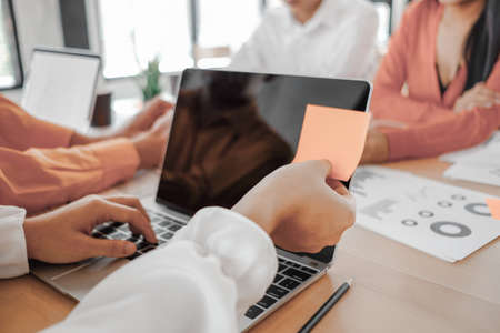 Business people analyzing investment graph meeting brainstorming and discussing plan in meeting room, investment conceptの写真素材