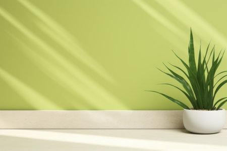 Potted plant sitting on floor in front of green wall. This image can be used to add touch of nature to interior design or as background for presentations and websites.の素材