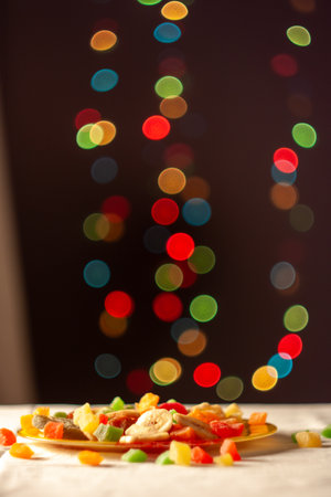 The image features a vibrant display of lights illuminating a plate of food, creating an atmosphere of festive celebration and culinary delight.の写真素材