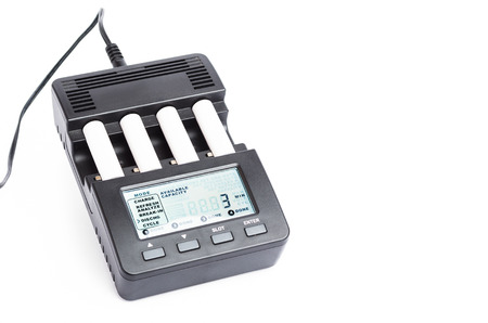 Four slot intelligent battery charger isolated on whiteの写真素材