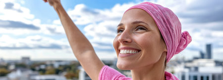 A beautiful breast cancer survivor raises her arm in triumph, symbolizing strength, hope, and awareness in the fight against cancer.の素材