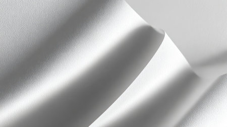 A high-key, abstract monochrome background showing smooth, flowing waves and folds of white paper or fabric, creating a sense of movement and texture with soft shadows, excellent for minimalist design, artistic presentations, and clean website backdrops.の素材