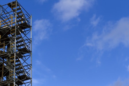Construction scaffolding element. Blue sky background. Construction or reconstruction conceptの写真素材