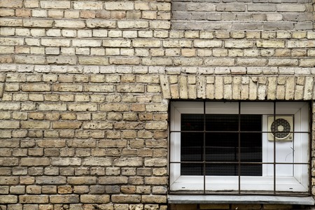 Old brick wall with plastic window fragment horizontal lines background texture. Oldtown.の写真素材