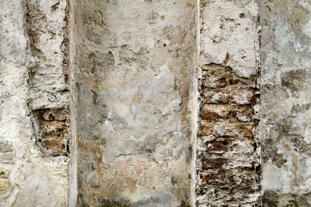 Old red brick wall with sprinkled white plaster texture background from oldtownの写真素材