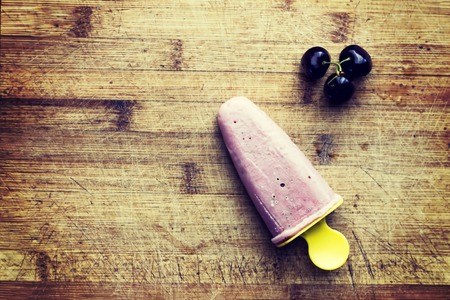 Homemade strawberry ice on old wooden background. Ice cream dessert for children. Summer food conceptの写真素材